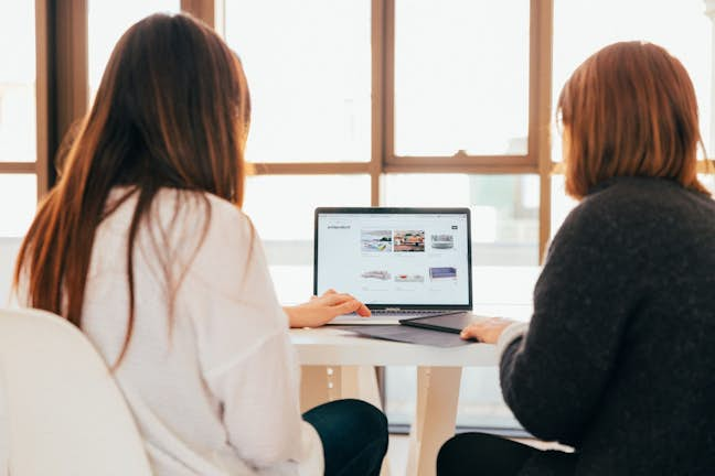 two people on laptop