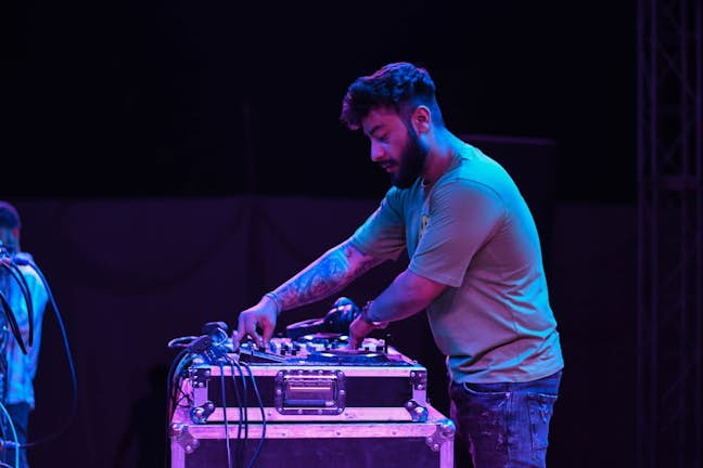 man using audio equipment at event