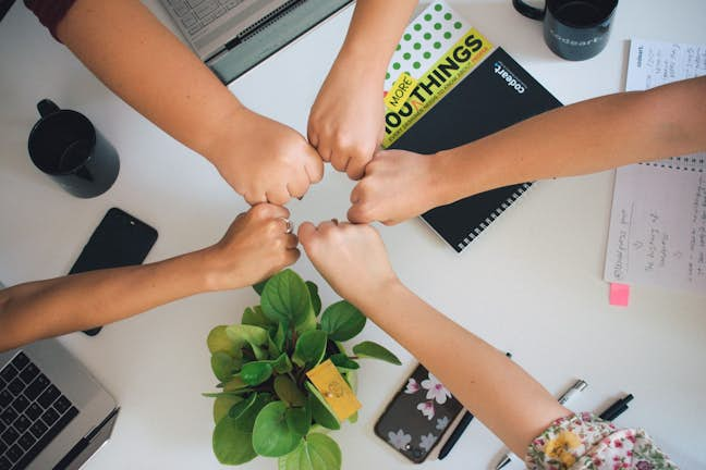 colleagues hands together