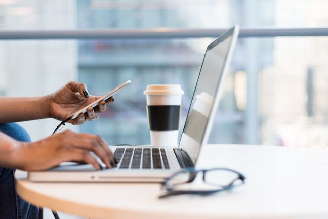 person typing on laptop