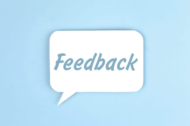 Blue background with speech bubble saying "feedback"