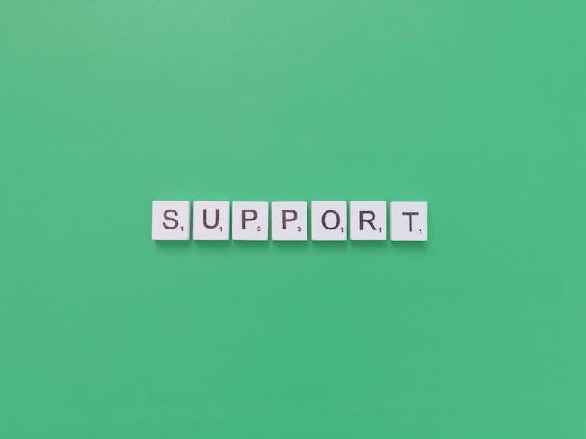 Word "Support" with green background