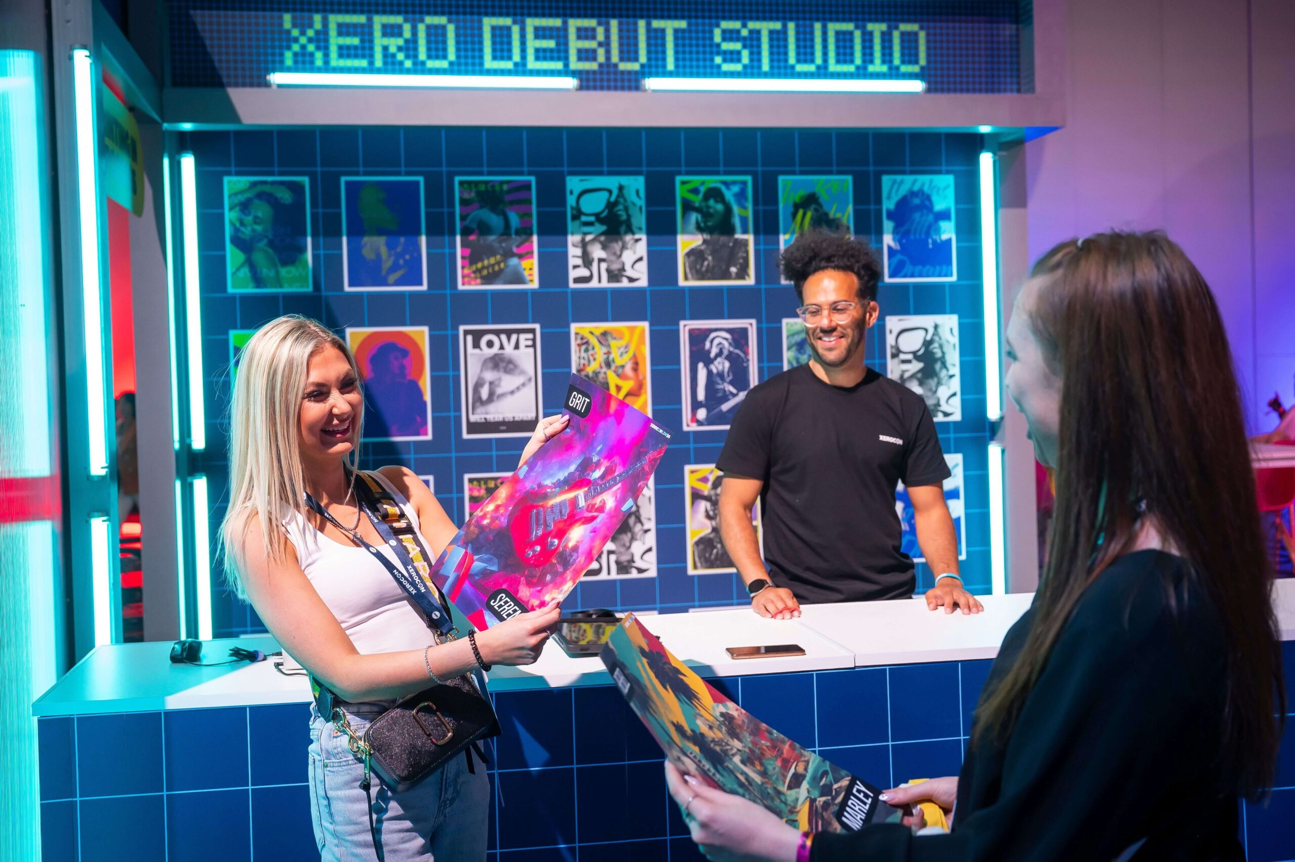 An attendee receiving their personalised AI-generated vinyl record at the Xero Debut Studio