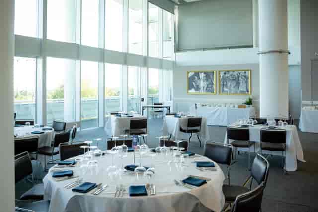 The Derby Suite at Epsom Downs: elegant event space with natural light for corporate gatherings.
