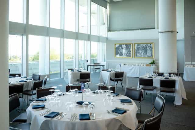 The Derby Suite at Epsom Downs: elegant event space with natural light for corporate gatherings.