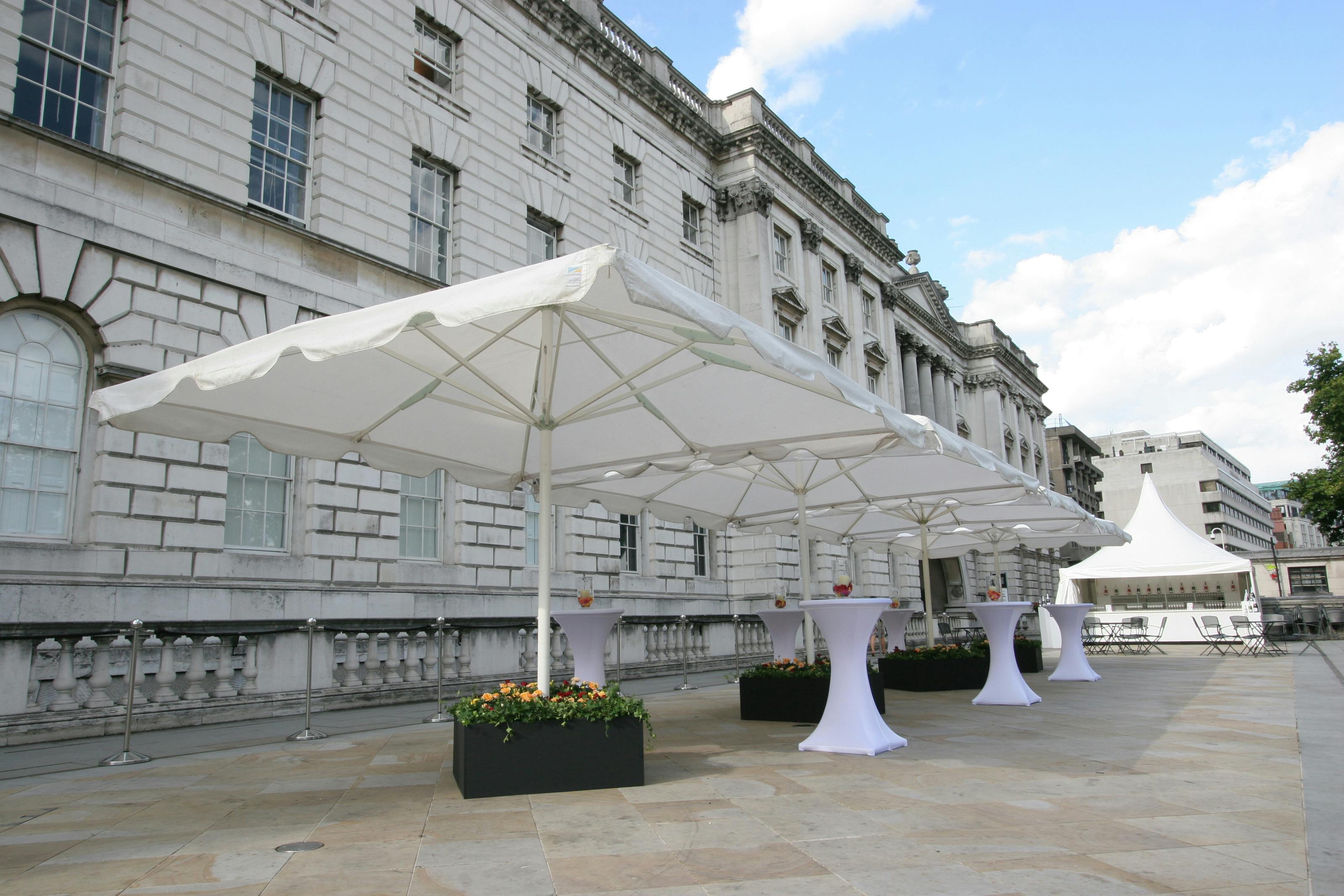 Elegant outdoor event space at Somerset House with white canopies for cocktail receptions.