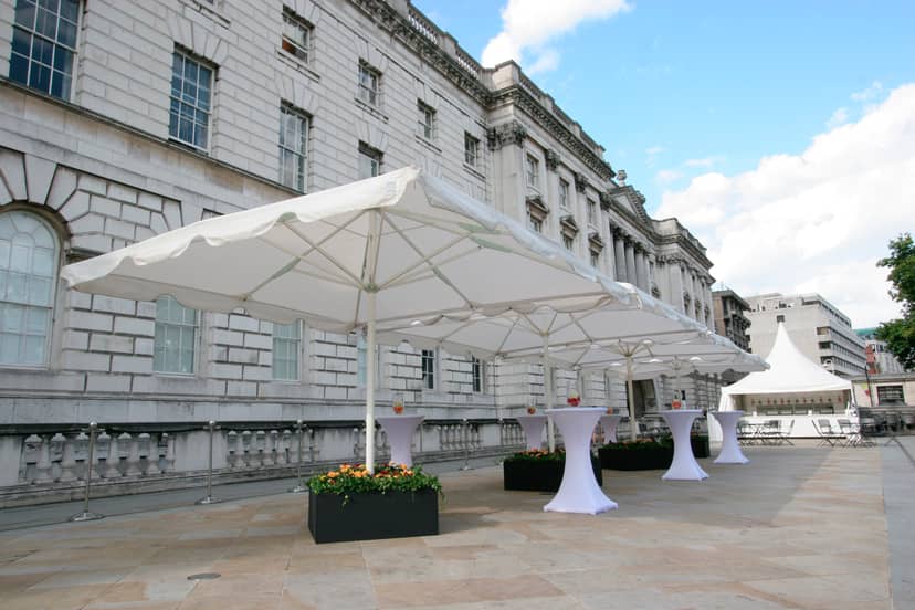 Elegant outdoor event space at Somerset House with white canopies for cocktail receptions.