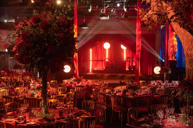 Elegant event space at Underglobe, featuring floral centerpieces for gala celebrations.