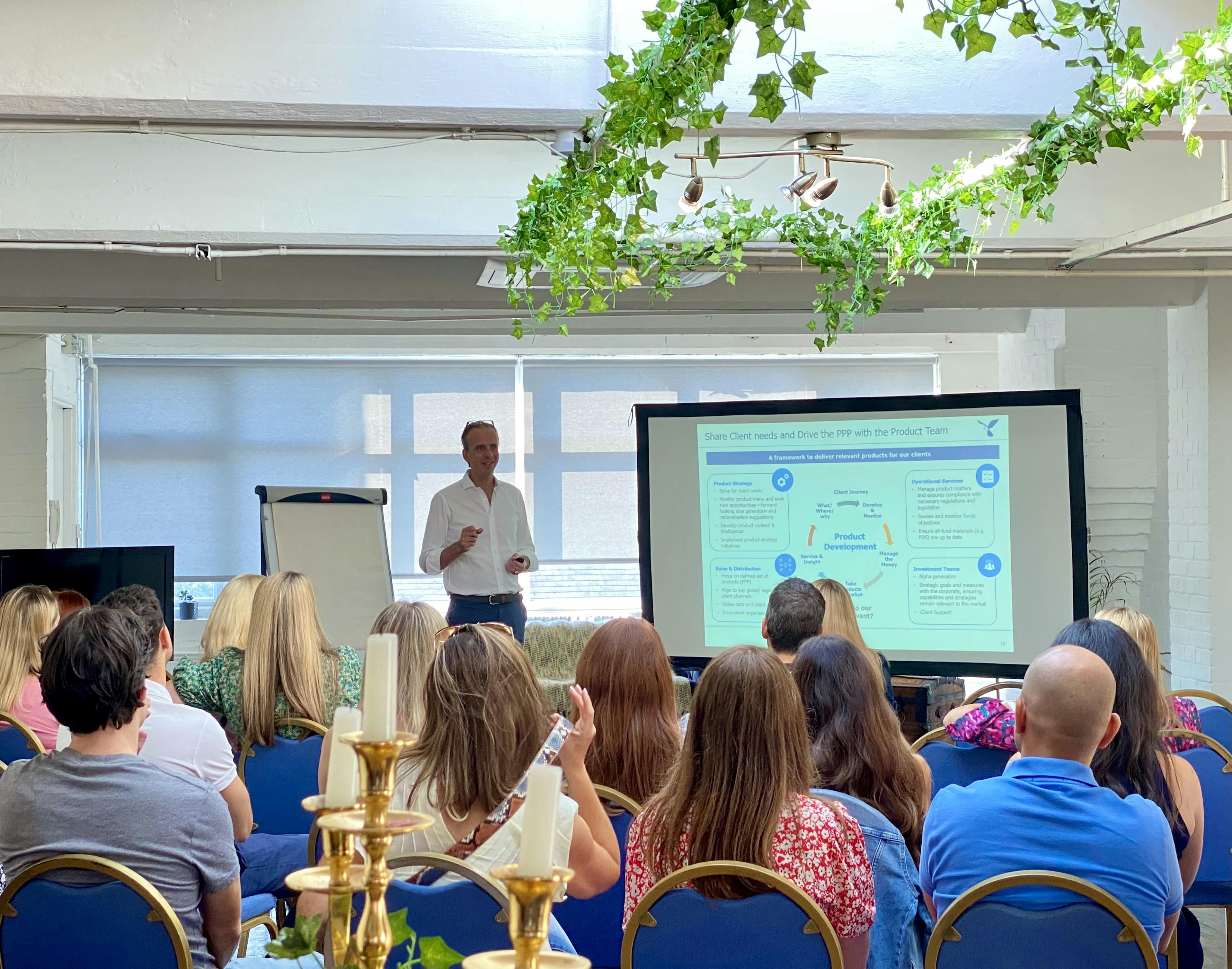 4th Floor Studios meeting space with presenter, large screen, ideal for workshops and events.