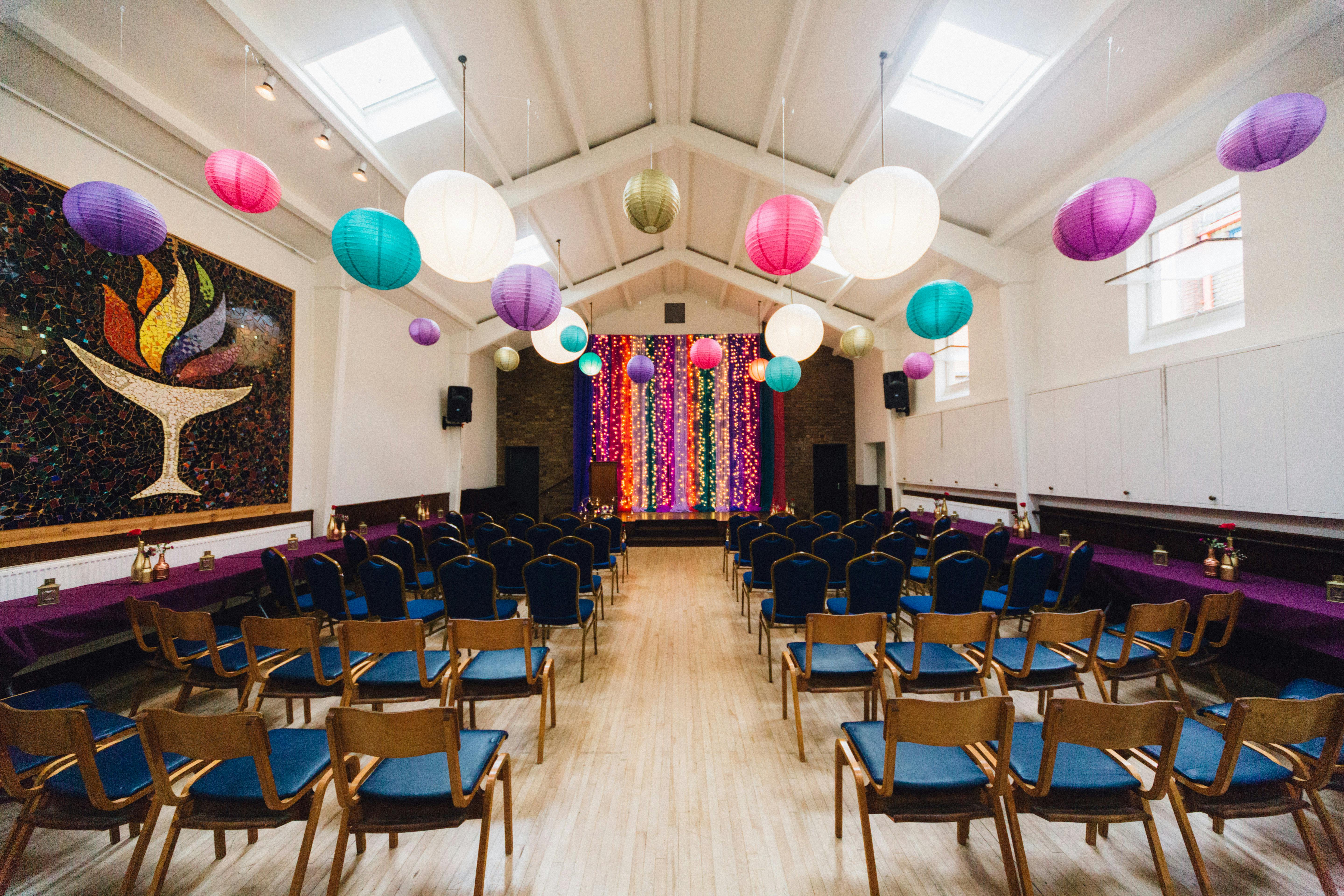 Vibrant event space in Unity Islington with colorful lanterns for gatherings and celebrations.