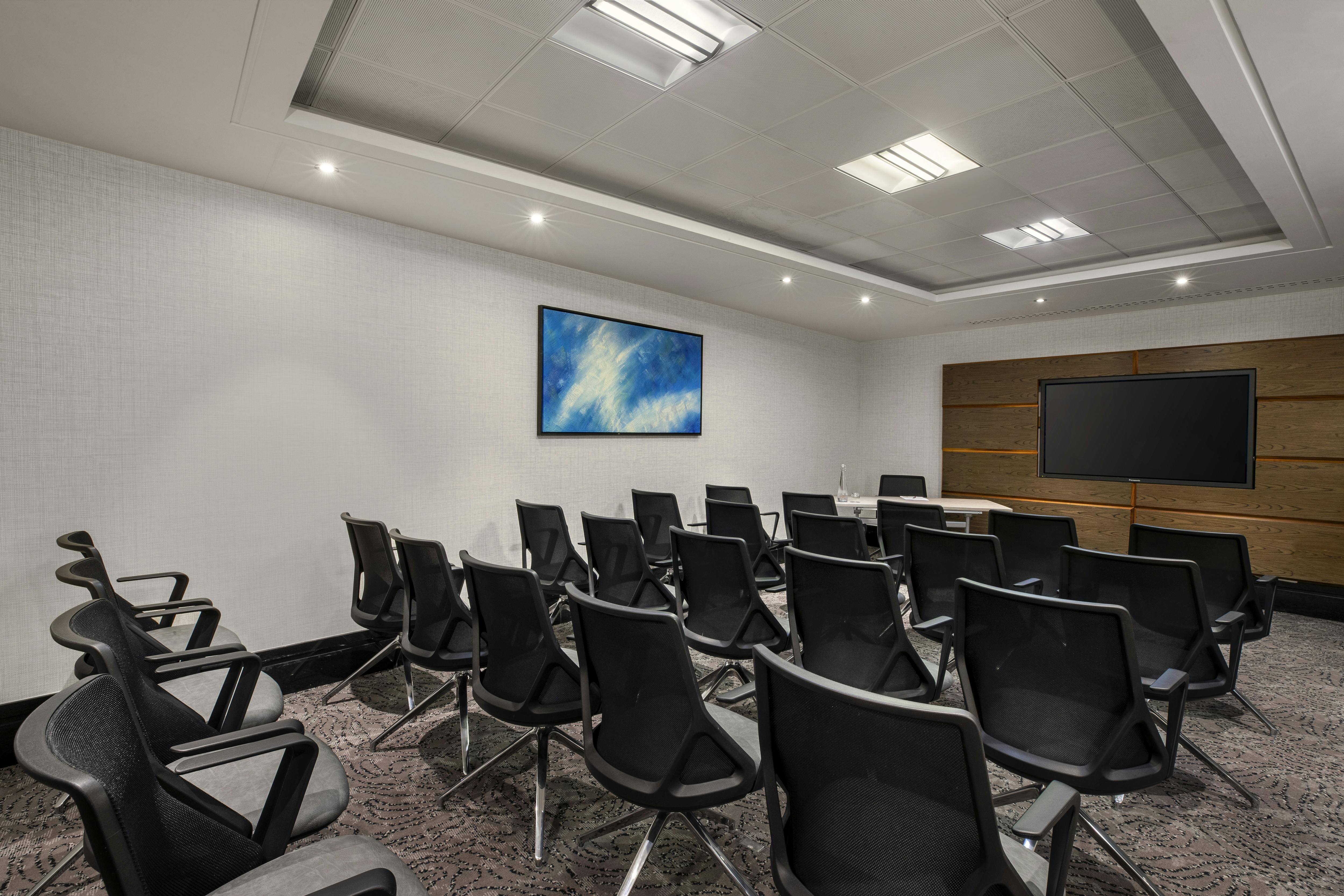 Johnson Suite at Leonardo Royal Hotel: modern meeting room with ergonomic chairs for workshops.