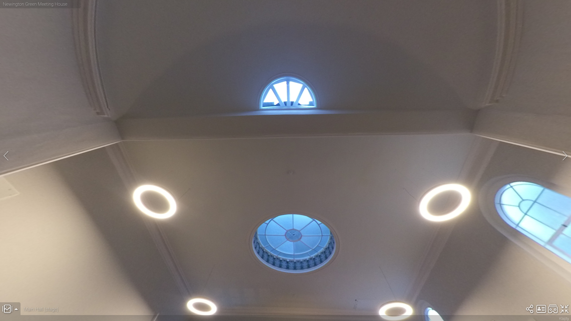 Main Hall in Newington Green Meeting House with skylights, ideal for events and gatherings. - Banner