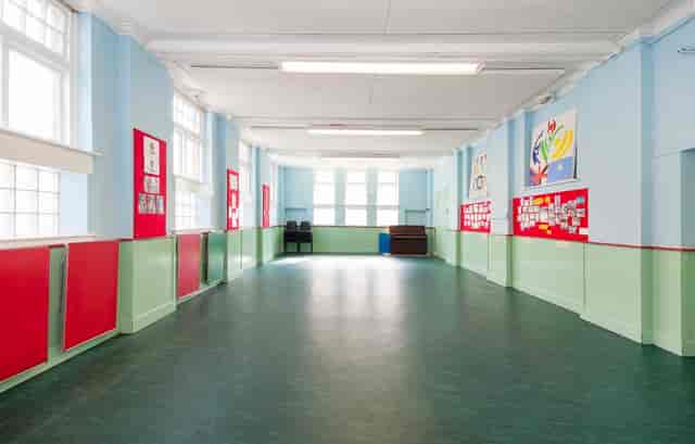 Blank-canvas event venue with high ceilings for corporate hire or professional events.