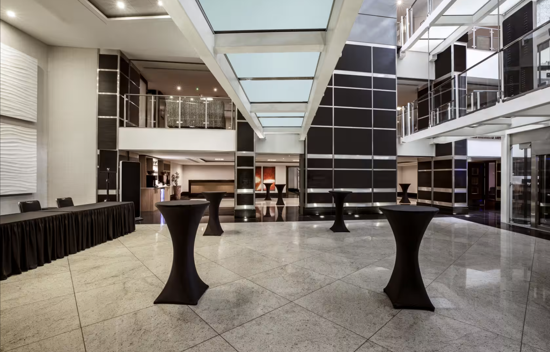 Wren & Shakespeare Suite: modern event space with skylights for networking and receptions. - Banner
