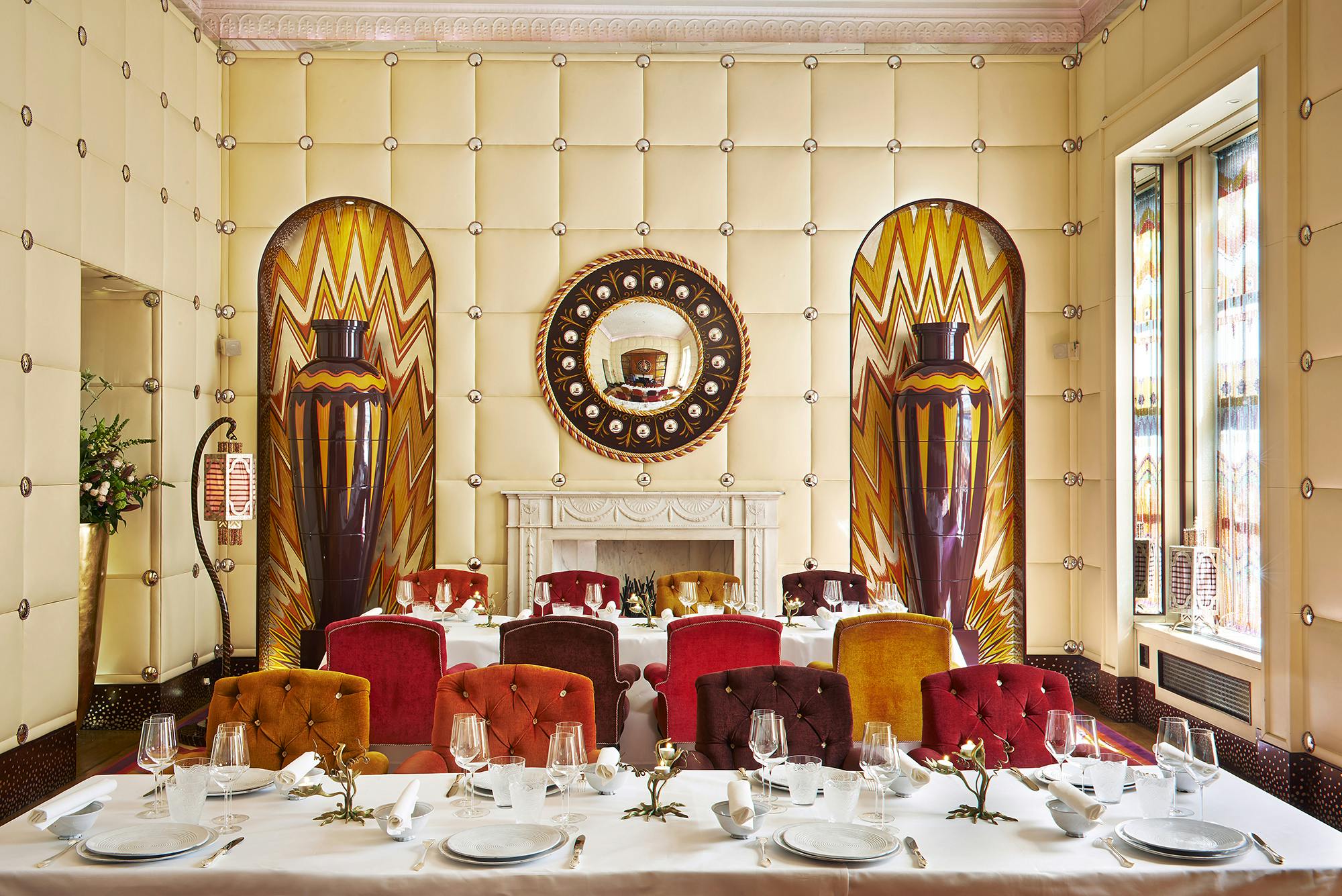 Elegant dining room sketch for upscale events, featuring rich colors and artistic decor.