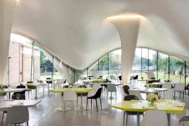 Modern event space with large windows, ideal for corporate meetings or intimate receptions.