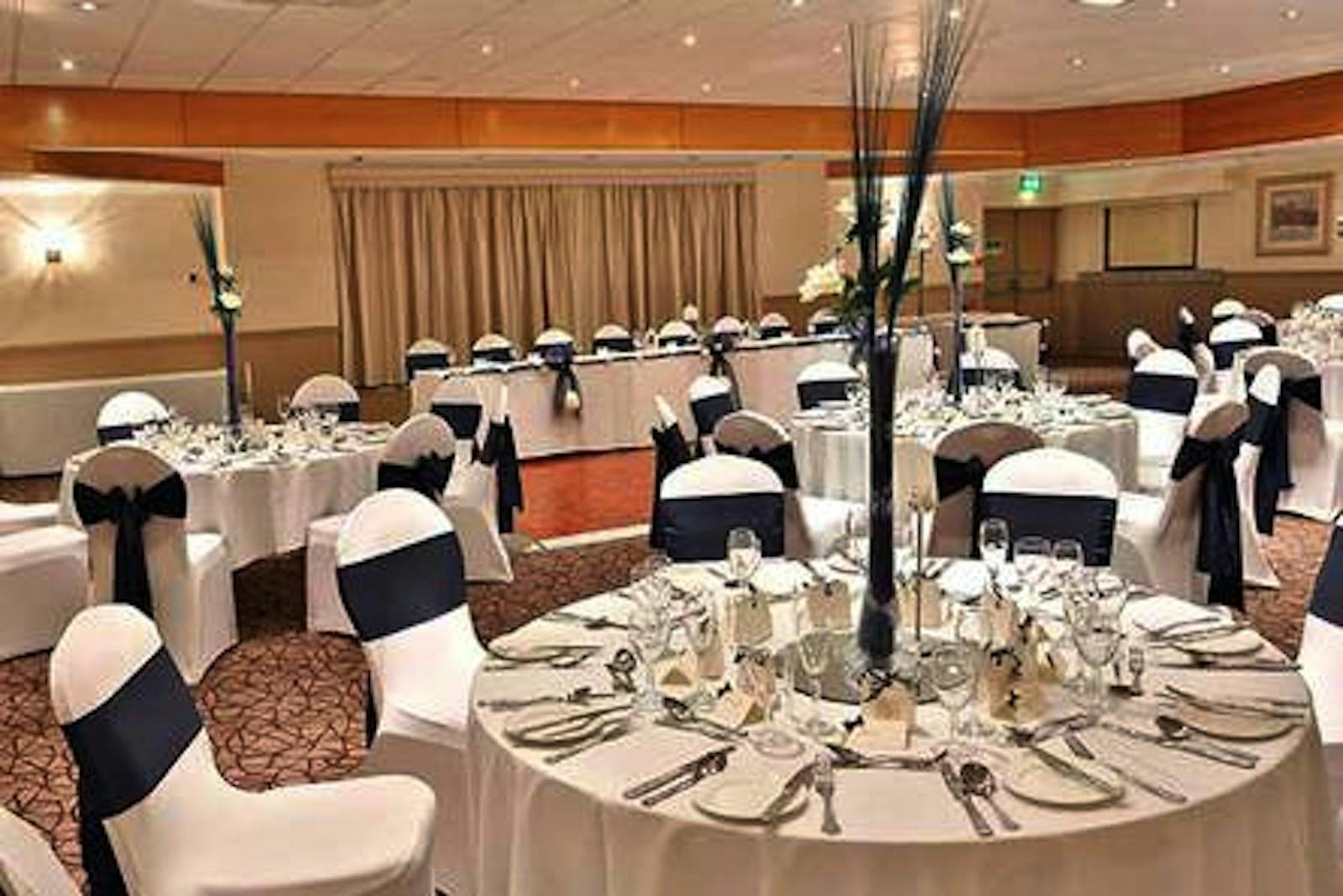 Elegant banquet setup at Cresta Court Hotel with navy blue accents for formal events.