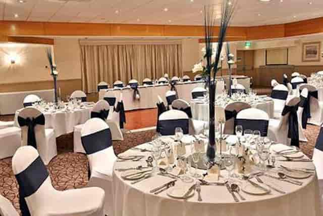 Elegant banquet setup at Cresta Court Hotel with navy blue accents for formal events.