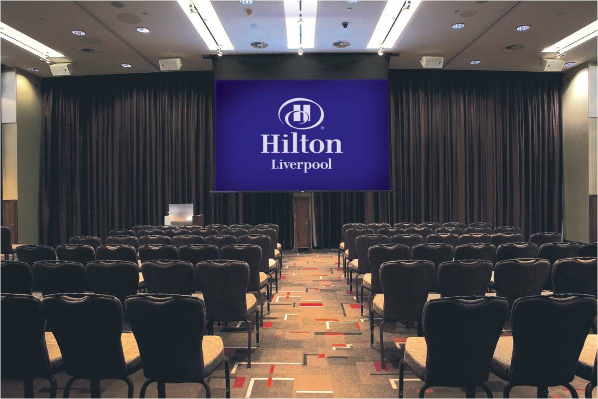 Grace Suite meeting room at Hilton Liverpool, featuring a large screen for corporate events.