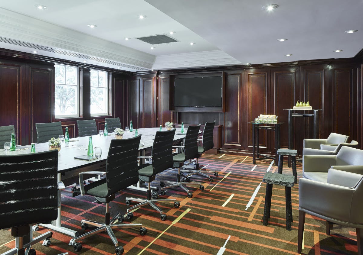 Boardroom at Leeds Marriott Hotel with sleek table, ideal for corporate meetings and events.