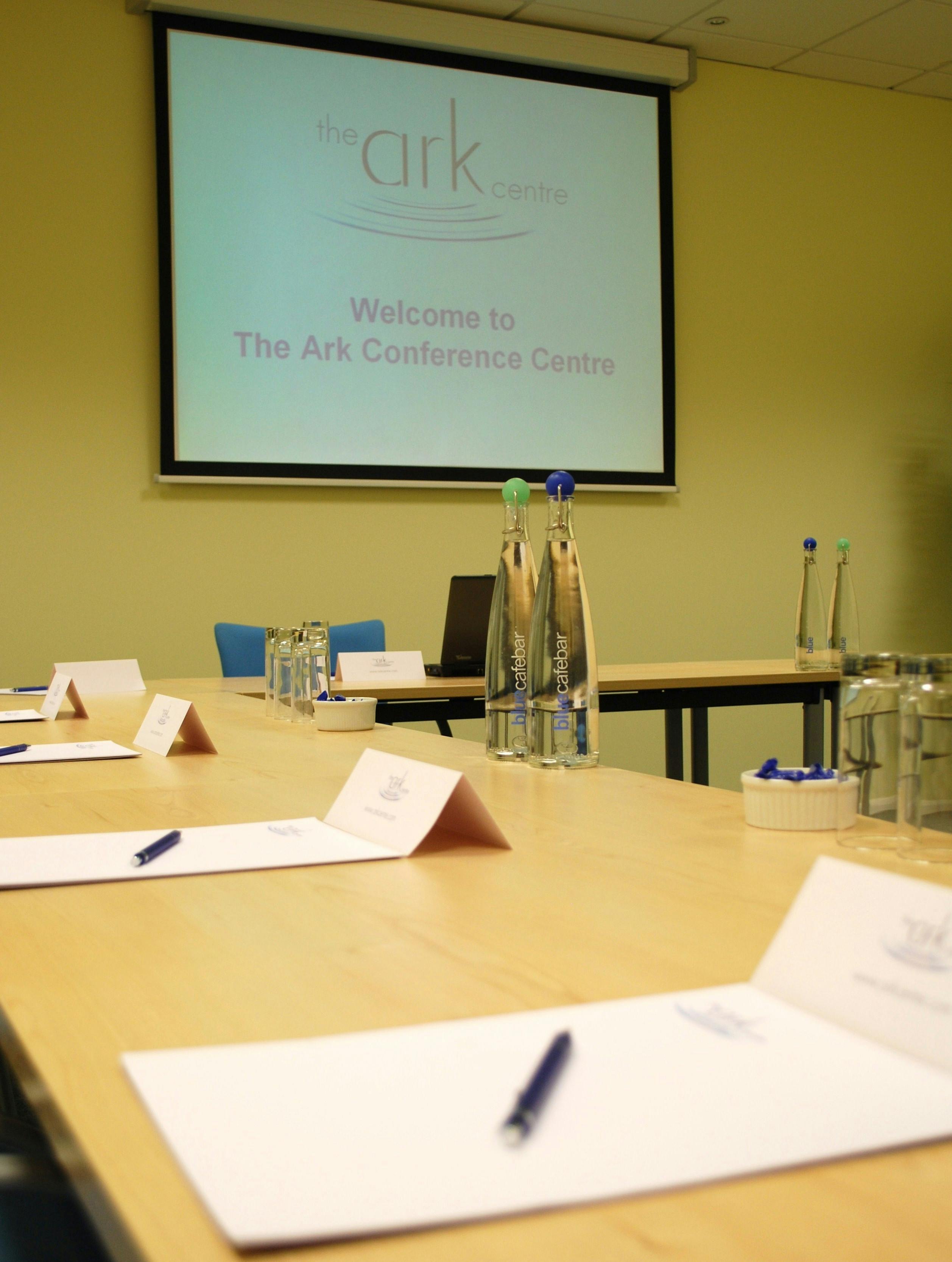 Meeting space at The Ark Conference Centre with arranged tables for professional events.