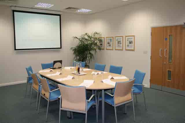 Meeting room at Ark Conference Centre with round table setup for workshops and gatherings.