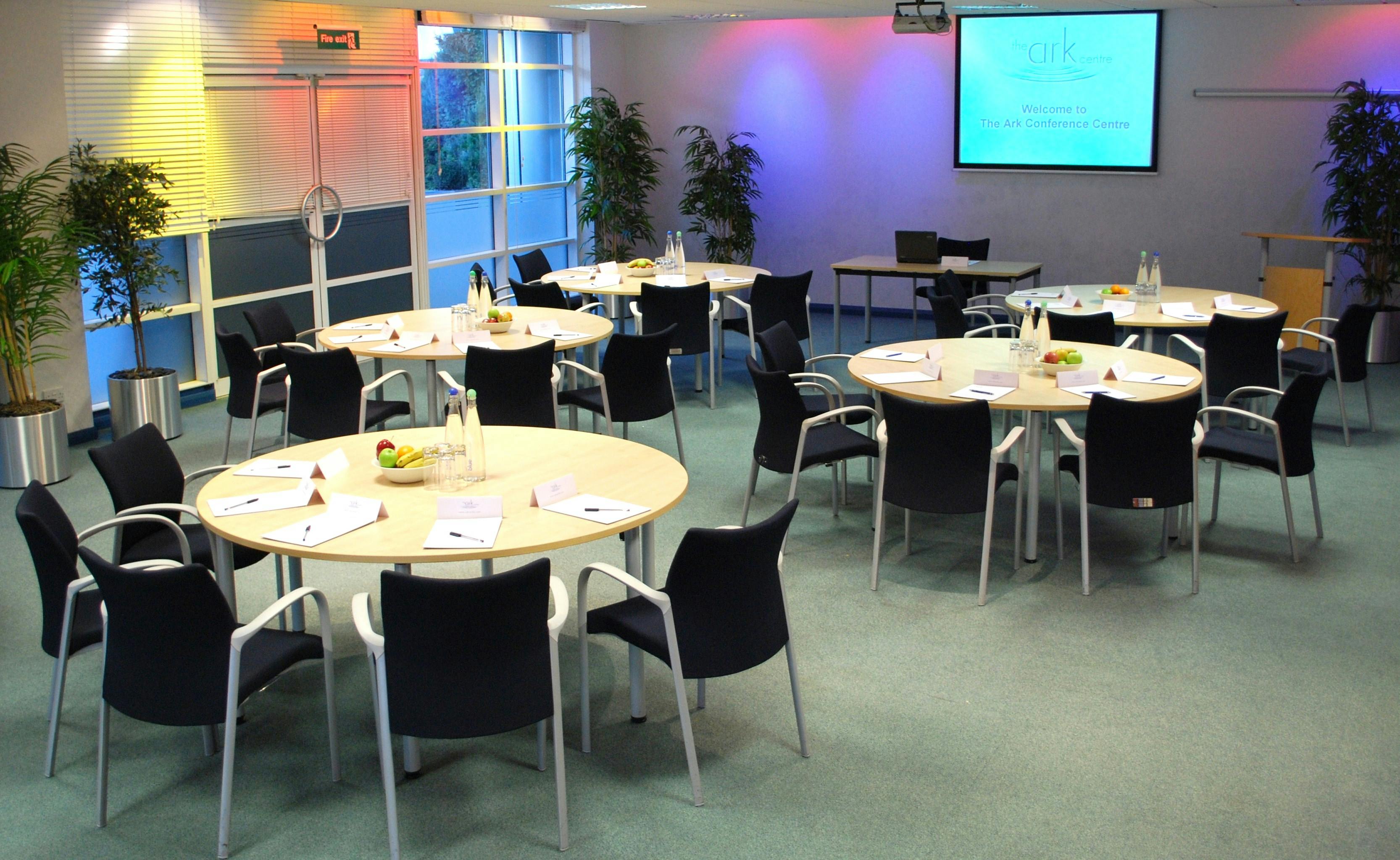 Caspian/Andaman meeting space with circular tables for collaborative events.