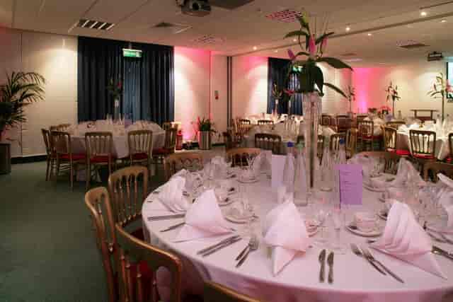 Elegant banquet hall with round tables, perfect for weddings and corporate events.