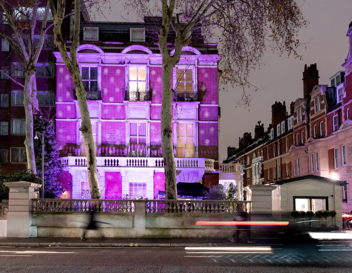 Christmas party venue in Kent House Knightsbridge with purple lighting and urban elegance.