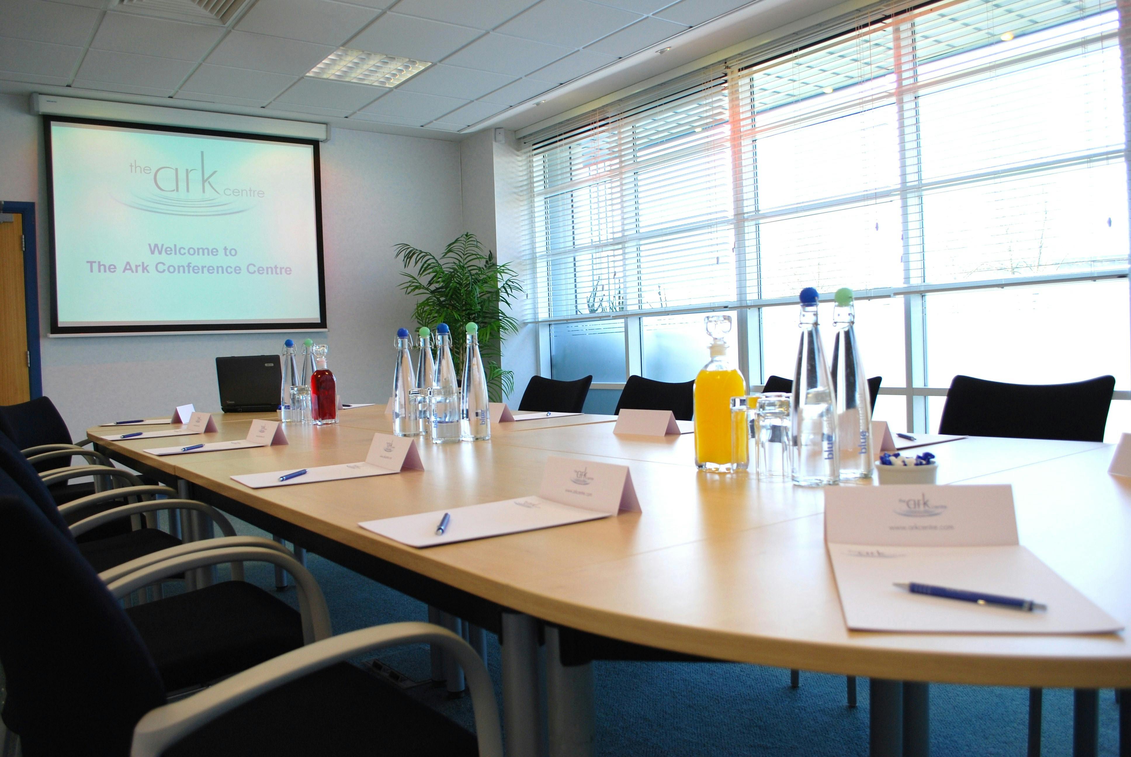 Conference room at The Ark Centre with oval table, ideal for meetings and events.