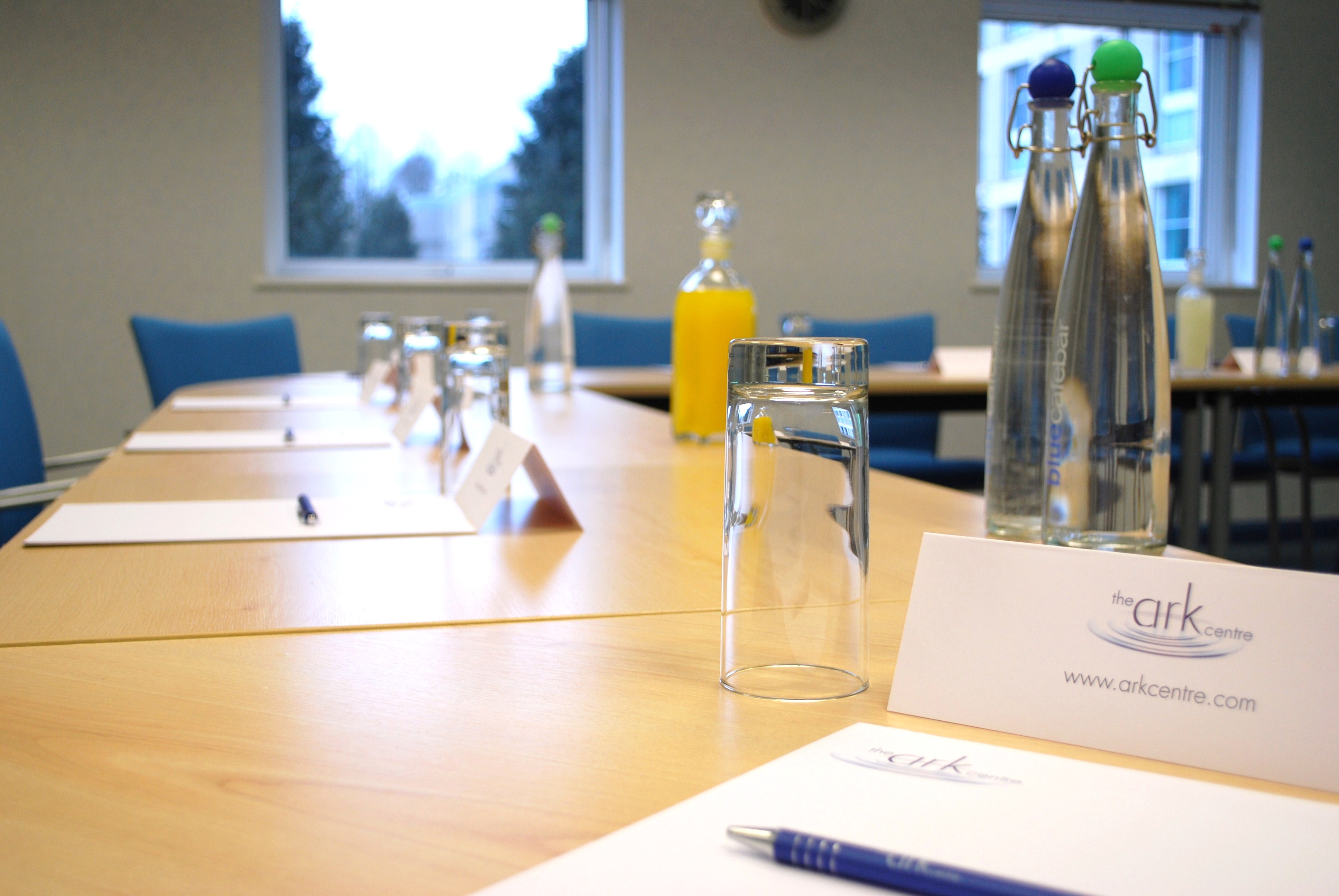 Meeting setup at The Ark Conference Centre with refreshments and natural light.