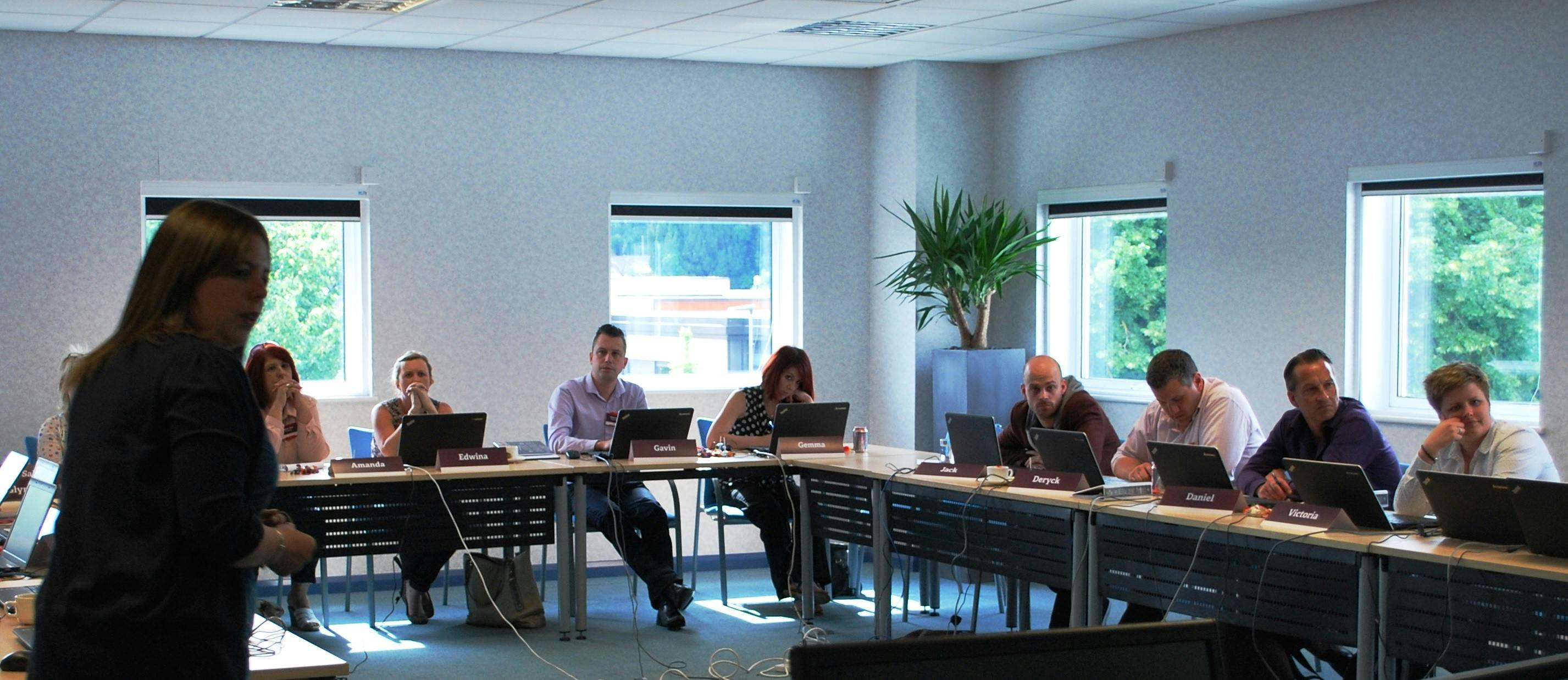 Professional meeting in Geneva's Ark Conference Centre with modern furnishings and technology.