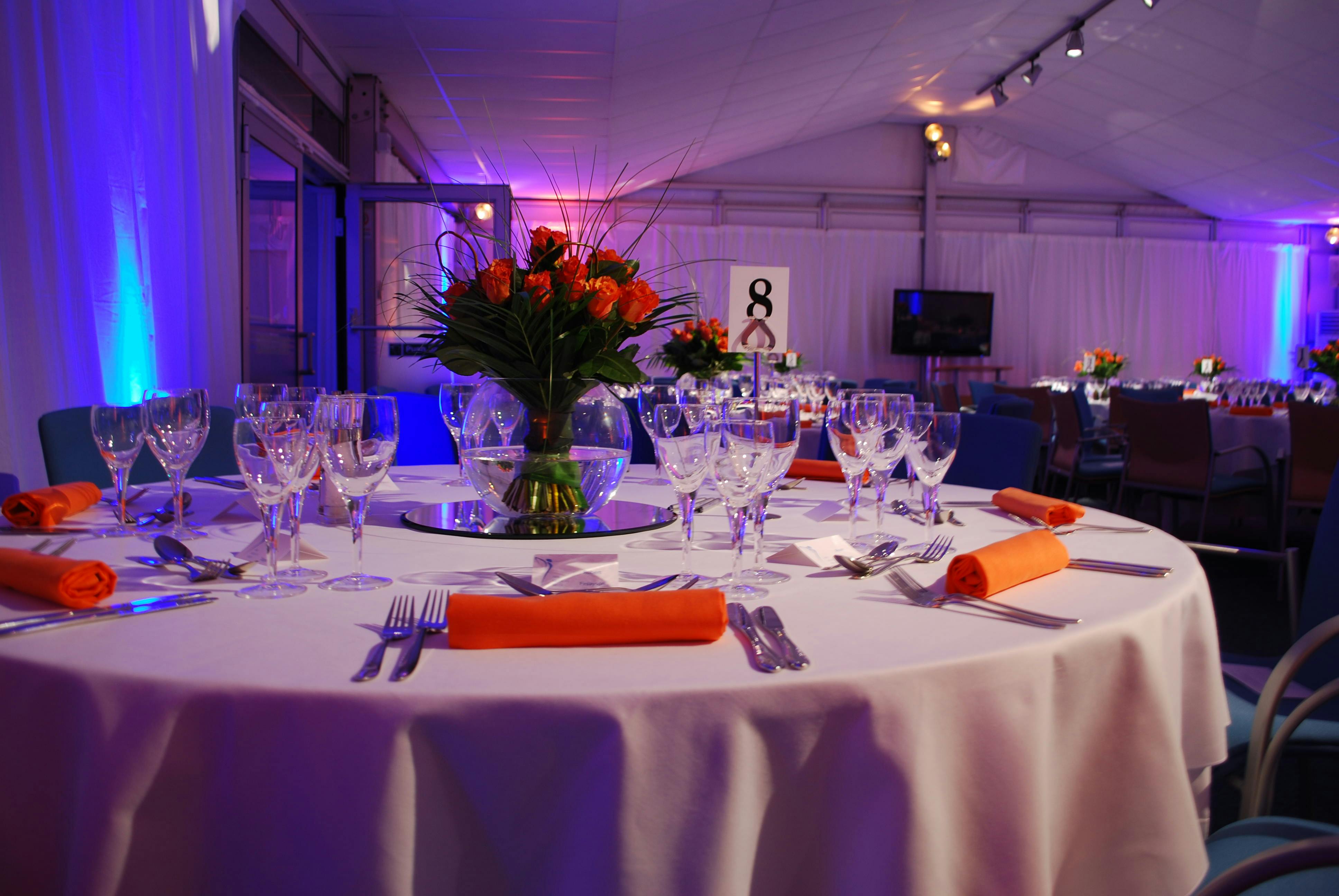 Elegant round table with roses in The Ark Conference Centre for formal events.