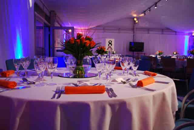 Elegant round table with roses in The Ark Conference Centre for formal events.