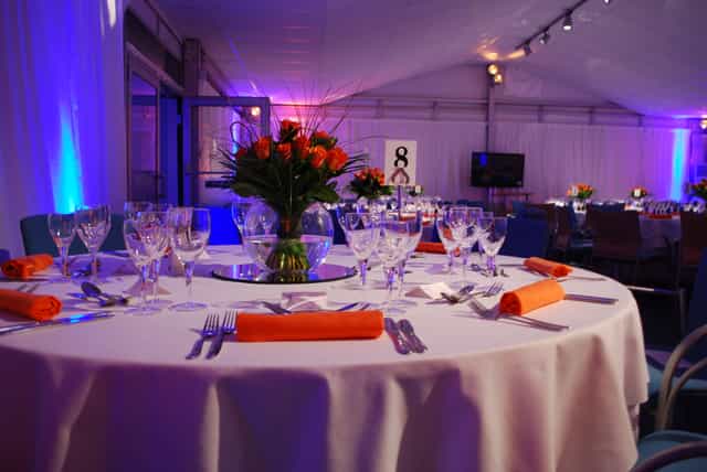 Elegant round table with roses in The Ark Conference Centre for formal events.