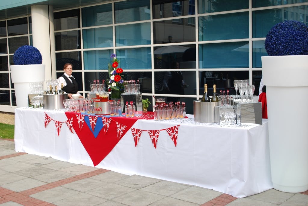 Outdoor beverage station with elegant glassware for events at The Ark Conference Centre.