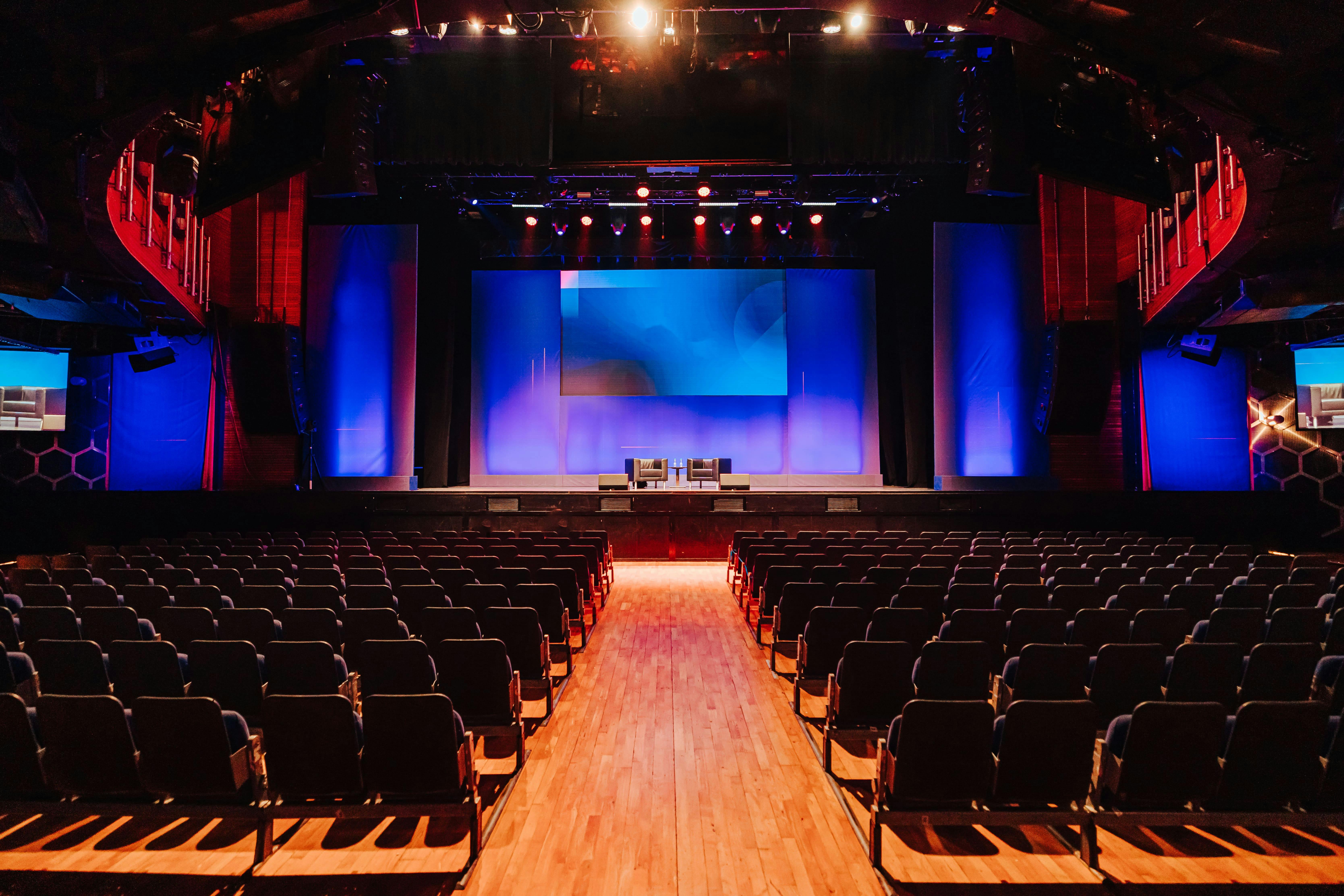 Event space at The O2 with tiered seating, ideal for conferences and presentations.