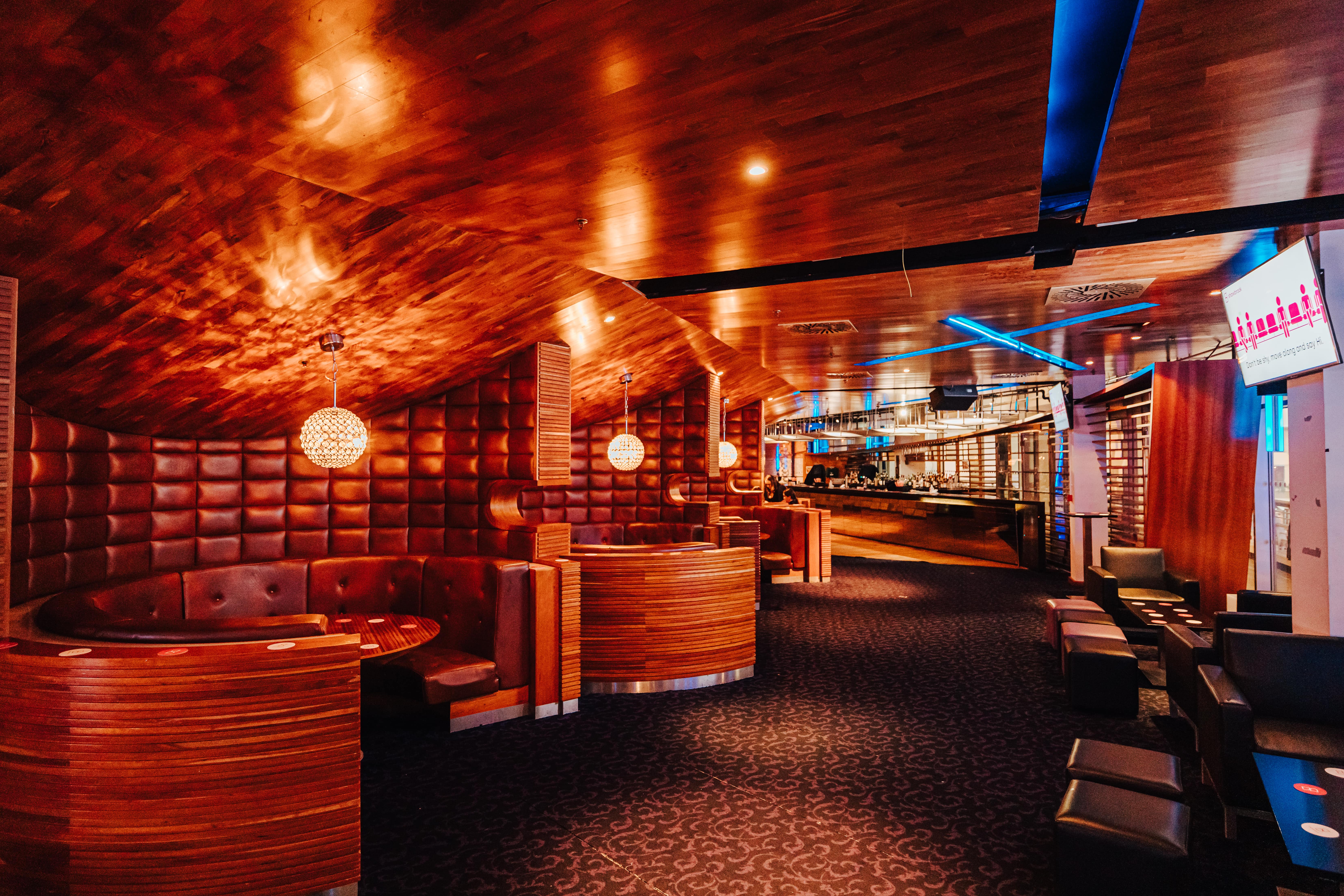 Stylish event space at The O2 with warm wood accents, perfect for gatherings and networking. - Banner