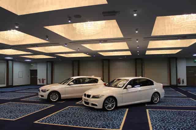 Wessex Ballroom at Renaissance London Heathrow with BMWs, ideal for luxury events.