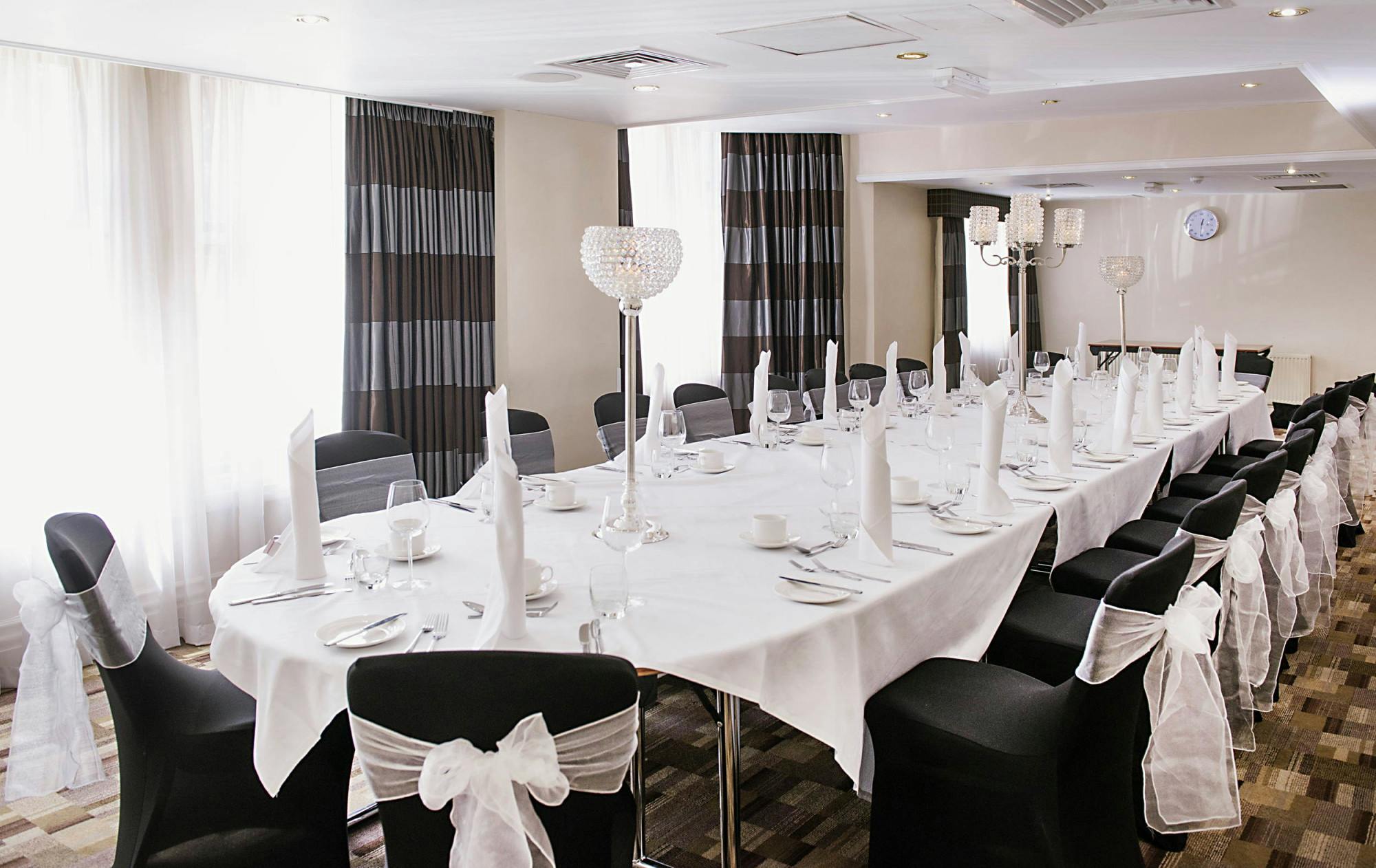 Tolkien Suite meeting room with elegant table settings for corporate events in Birmingham.