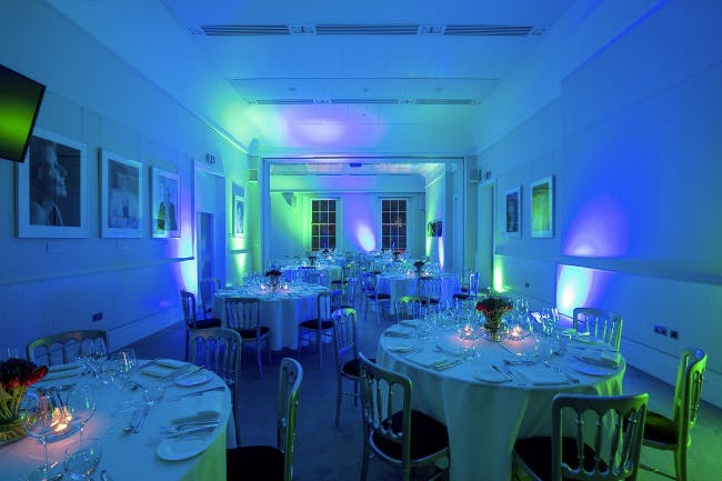 Elegant dinner setup in Al Qasimi, Prince Philip House with fine dining and ambient lighting.