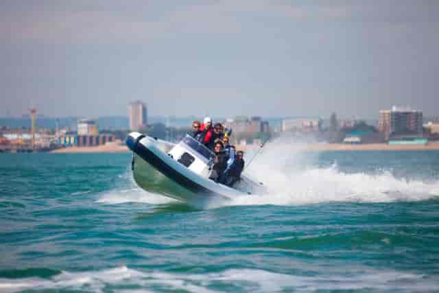 High-energy team-building speedboat activity at No Man's Fort for corporate retreats.