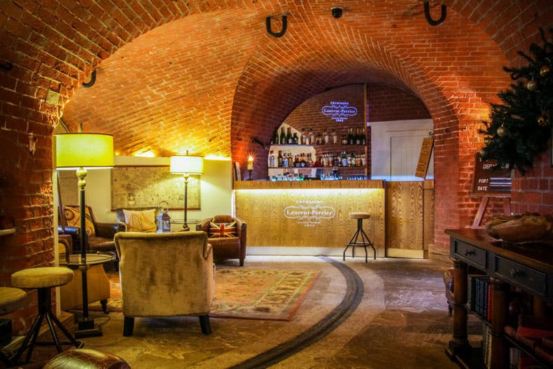 Cozy venue at Spitbank Fort with rustic brick, ideal for intimate events and gatherings.