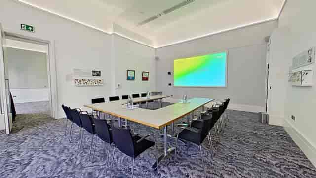 Modern meeting room at Michael Bishop Foundation with ergonomic chairs for collaboration.