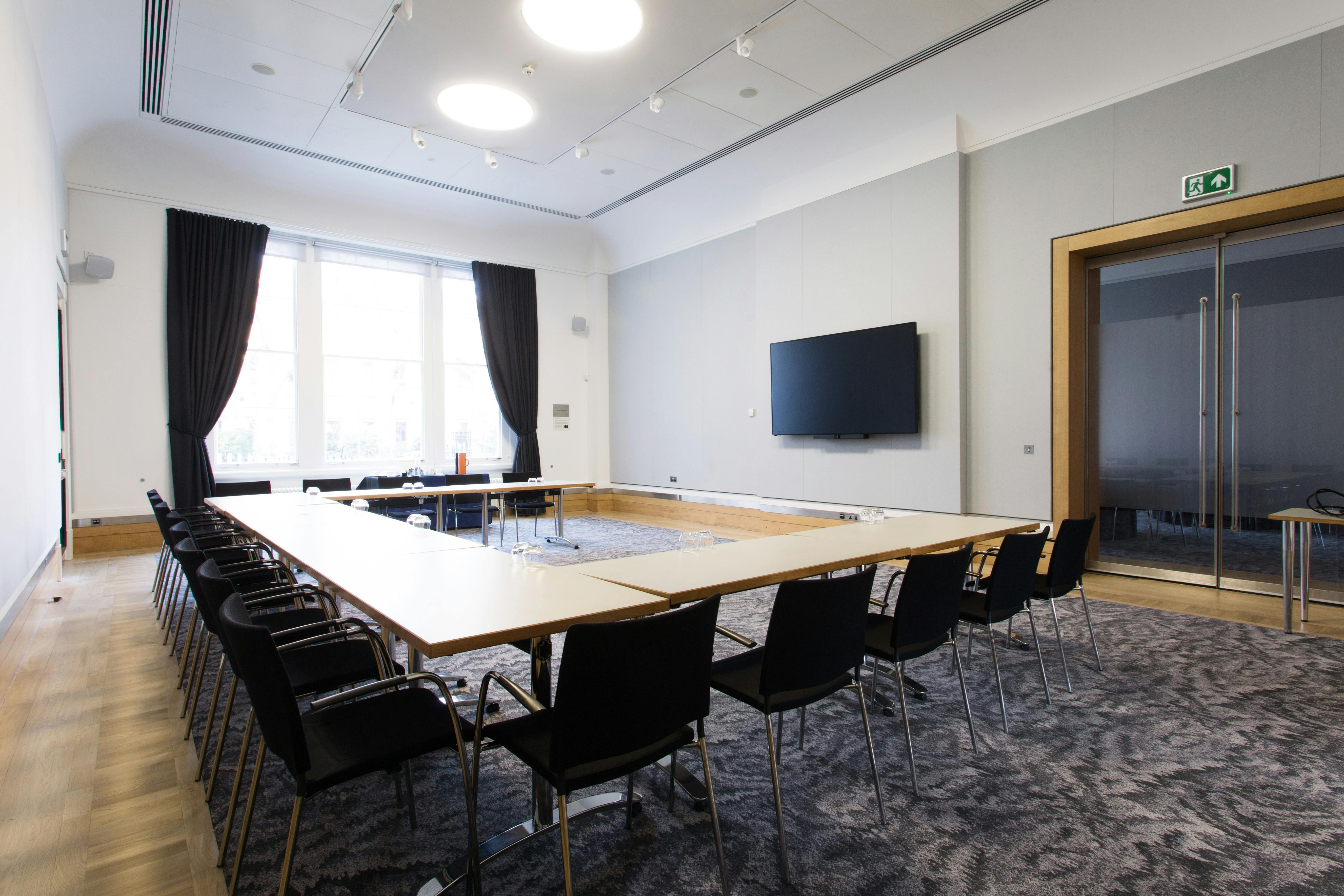 Rolls Royce meeting room with large table, ideal for professional events and gatherings.