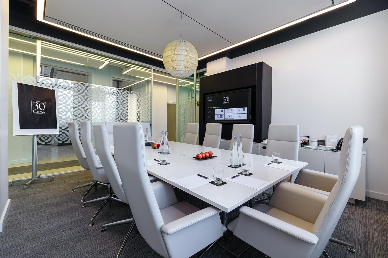 Modern conference room with sleek table and ergonomic chairs at 30 Euston Square meetings.