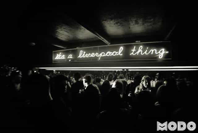 Vibrant networking event at Modo with neon "It's a Liverpool thing" sign.