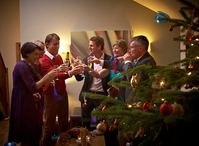 Festive gathering at Forest Cabin with Christmas tree, ideal for holiday events.