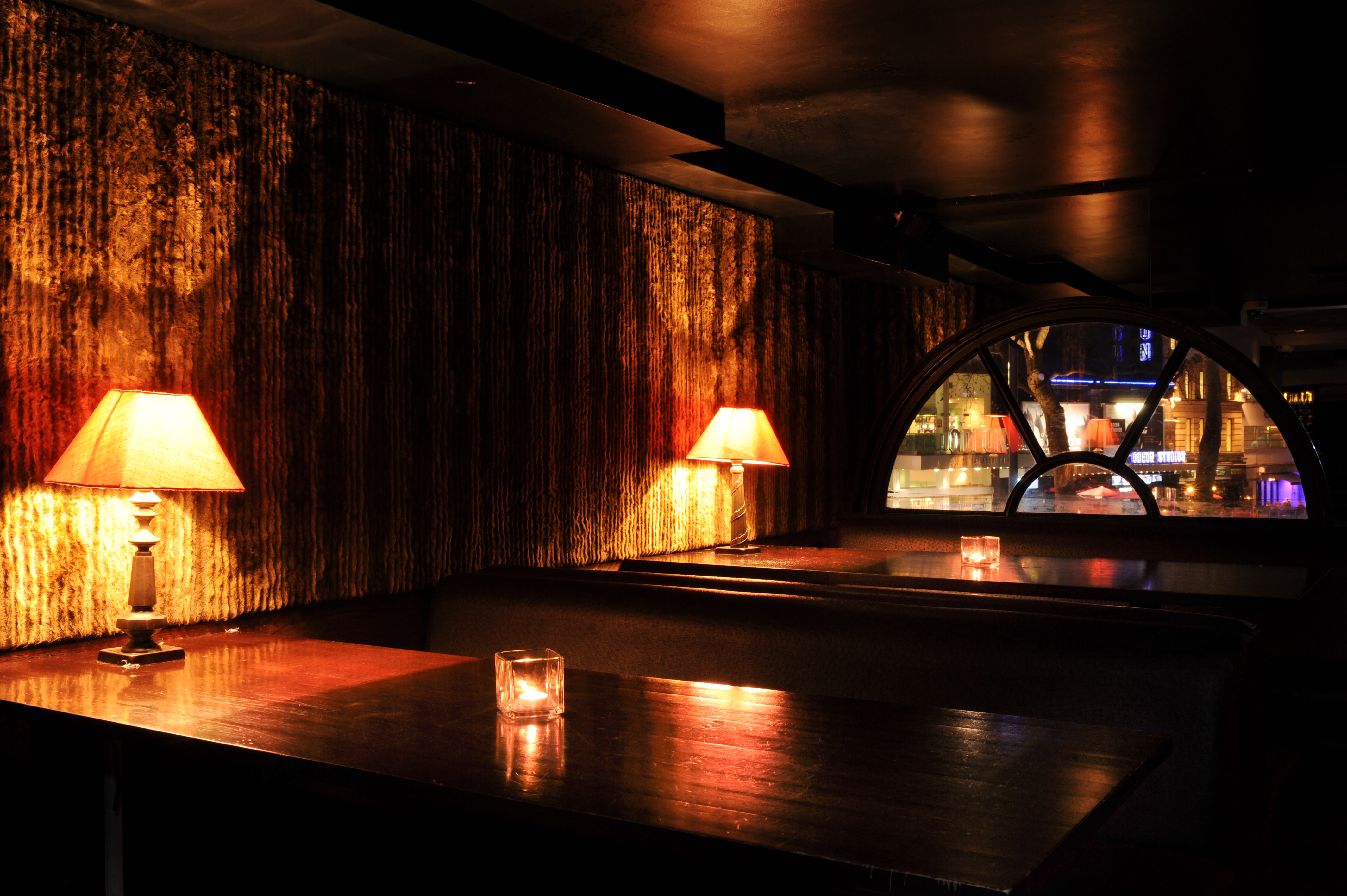 Intimate Ruby Blue club venue with warm lighting for private events and gatherings. - Banner