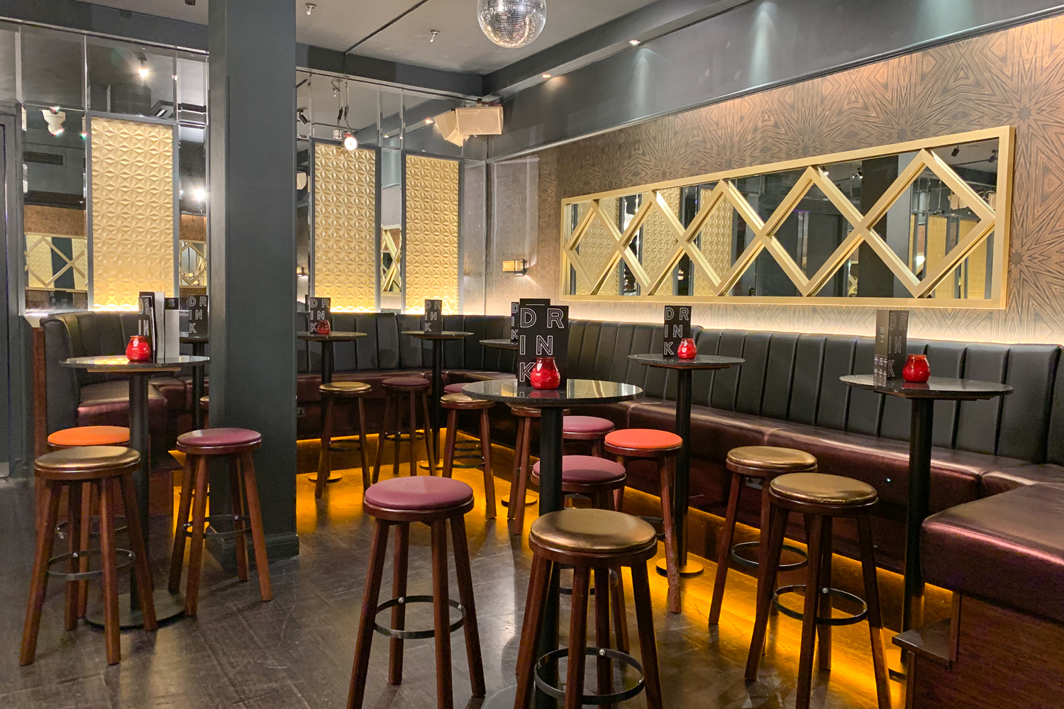 Sophisticated event space with high-top tables, perfect for networking and cocktail receptions. - Banner